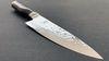 
                    Kai Chef's knife with blade refined by a hammer stroke surface