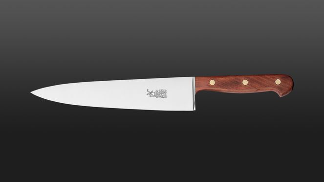
                    The carbon steel chef's knife has a cherry wooden handle